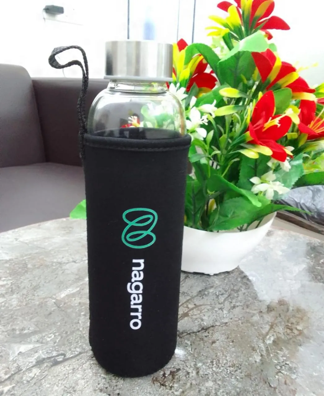 Glass bottle with branded sleeve, Nagarro